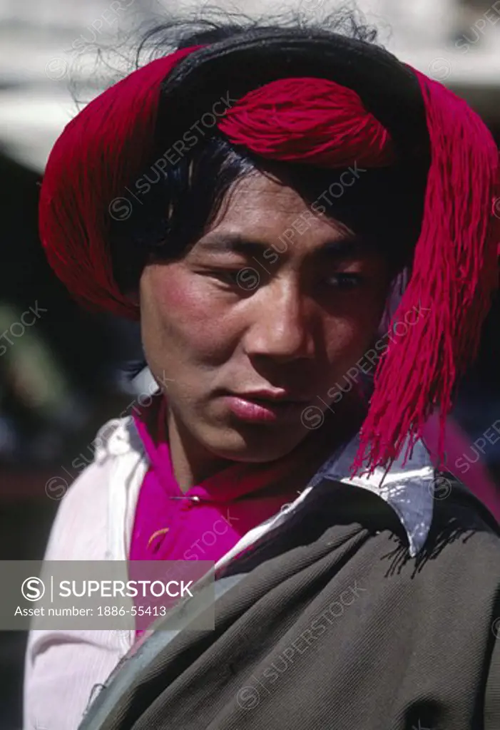 Khampa warriors wear red tassels in their on the Barkhor - Lhasa, Tibet