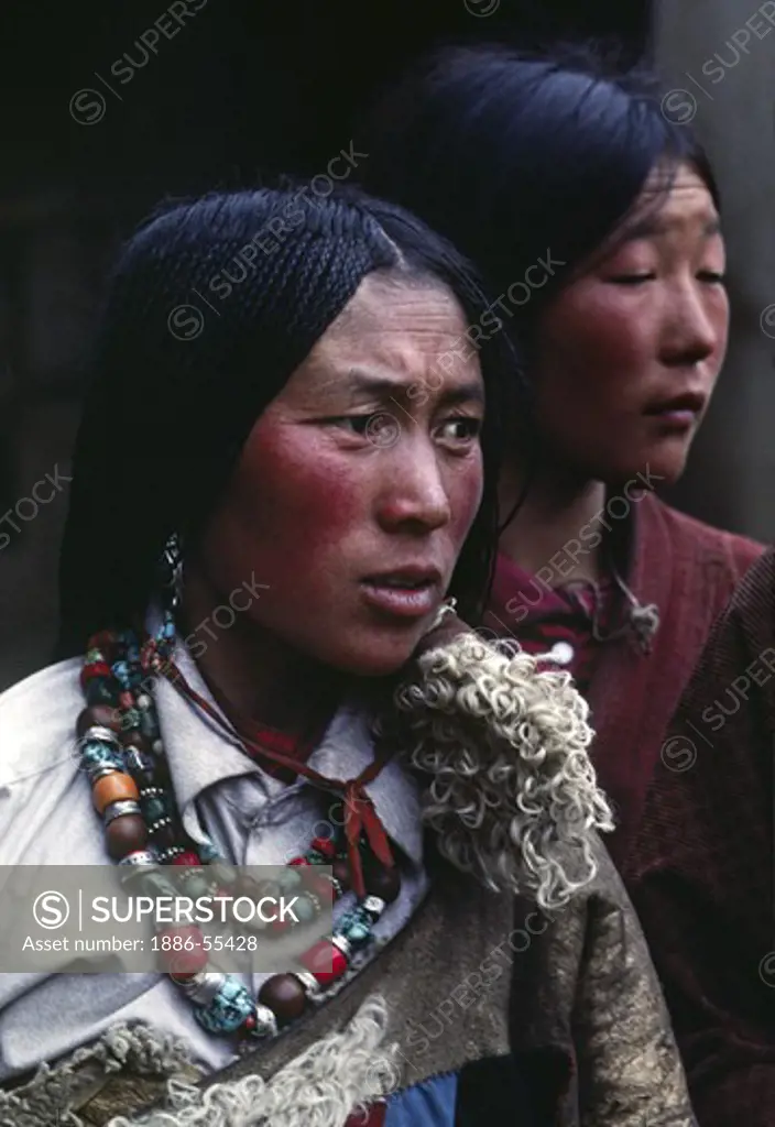 Tibetan pilgrim woman with beautiful jewelry & traditional 108 braids at Sera Monastery - Lhasa, Tibet