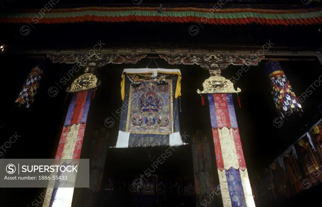 A tanka painting hangs from the temple ceiling at Sera Monastery in Lhasa, Tibet. Sera Monastery, Lhasa, Tibet, China