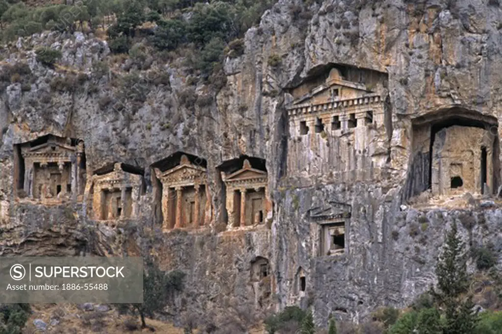 The ancient tombs carved into cliffs near The Ruins of CAUNUS (400 BC onwards) - TURQUOISE COAST, TURKEY