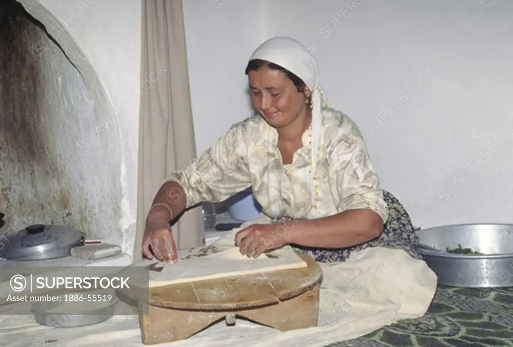 Turkish woman prepare a typical meal in the village of BEZIRGAN - TURKEY