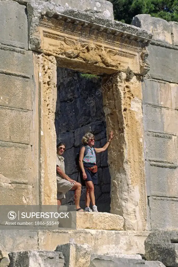 Catherine & woman in a doorway at the ancient LYCIAN ruins of ARYKANDA (400 BC) - TURKEY
