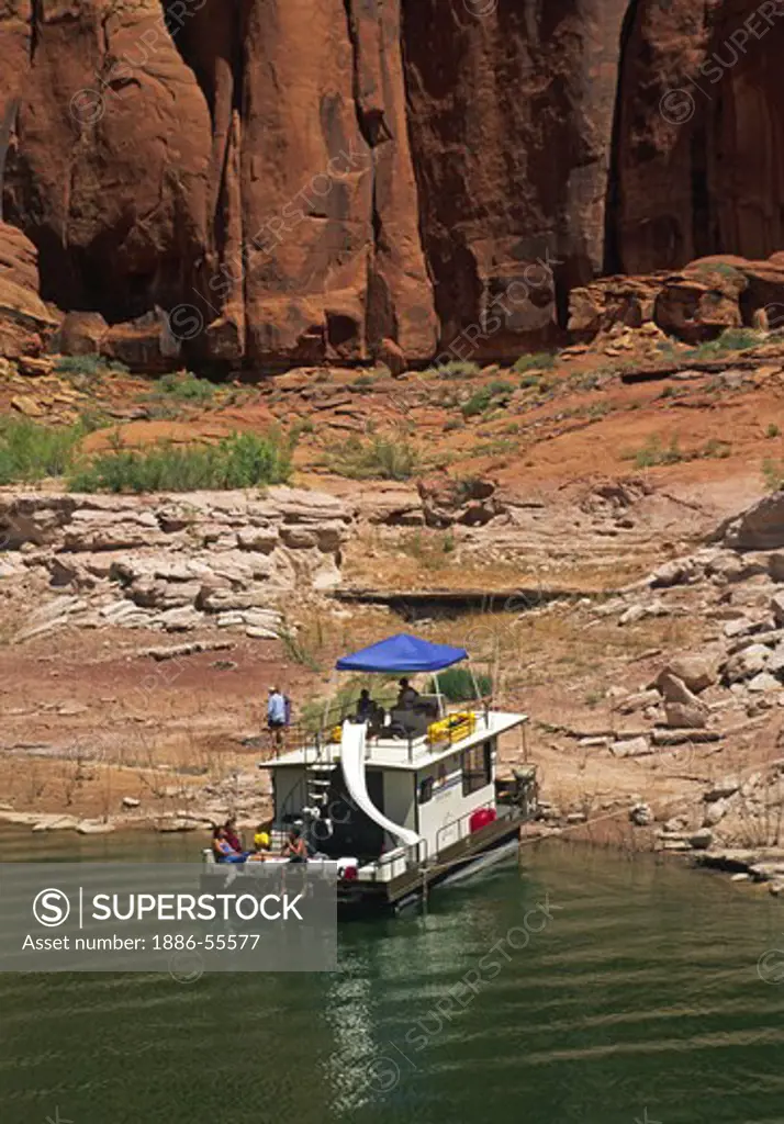 A HOUSE BOAT at anchor in LLEWELLYN GULCH in LAKE POWELL NATIONAL RECREATION AREA - UTAH