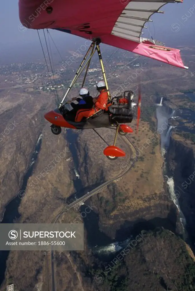 Flying tandem in an ULTRALIGHT (motorized hanglider) with an aerial view of VICTORIA FALLS - ZIMBABWE