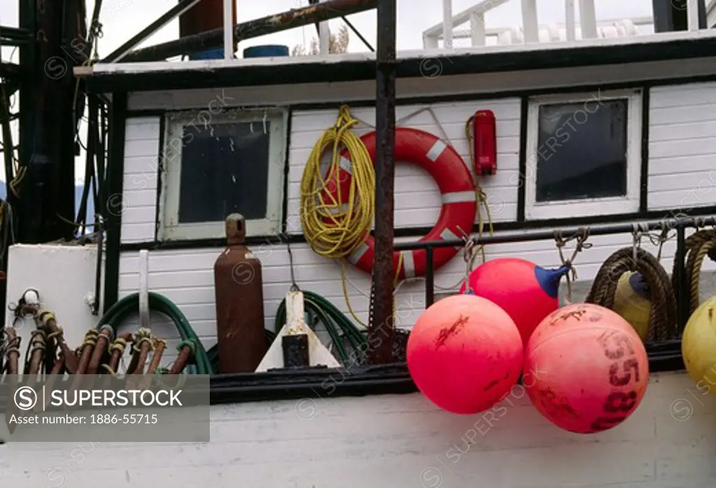 The colorful FISHING FLOATS of a BOAT at dock in SEWARD HARBOR-ALASKA