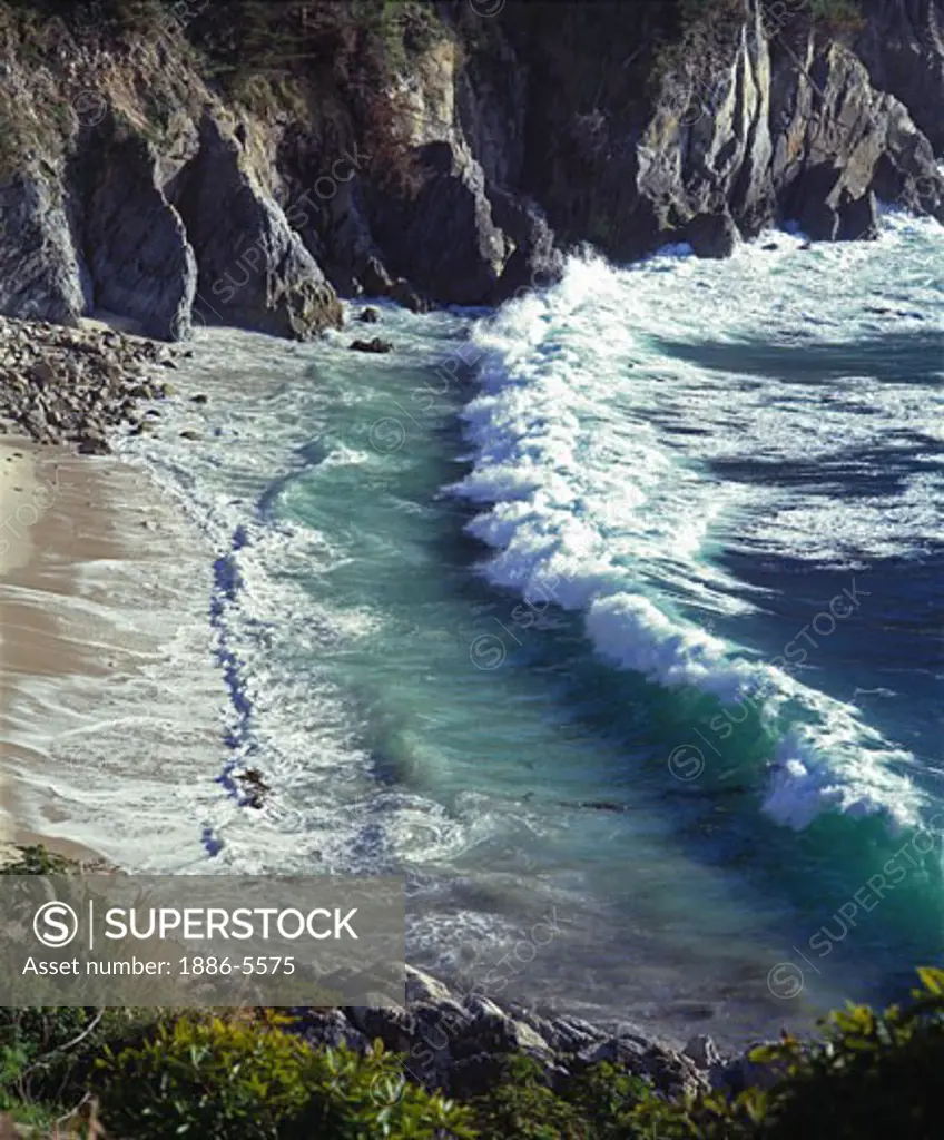 A PACIFIC WAVE meets the shore in the CARMEL HIGHLANDS - MONTEREY BAY SANCTUARY, CALIFORNIA  