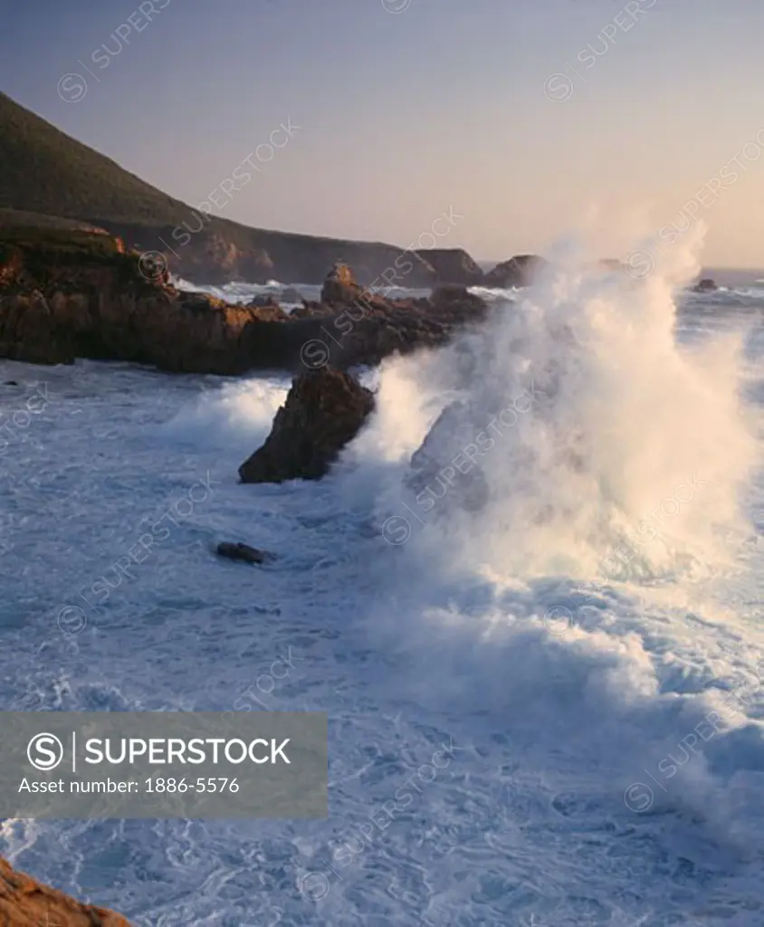 A large PACIFIC WAVE smashes against the rocks at GARAPATA STATE BEACH - MONTEREY BAY SANCTUARY, CALIFORNIA  