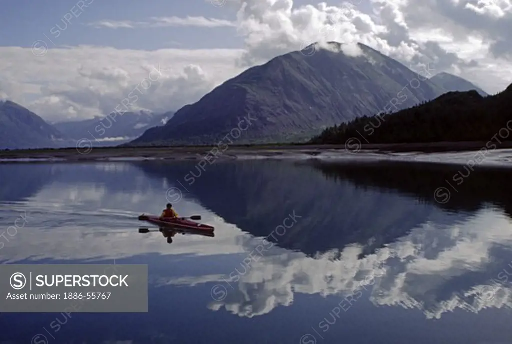 A KAYAKER surrounded by the majestic serenity of ADAMS INLET - GLACIER BAY NATIONAL PARK, ALASKA (MR)