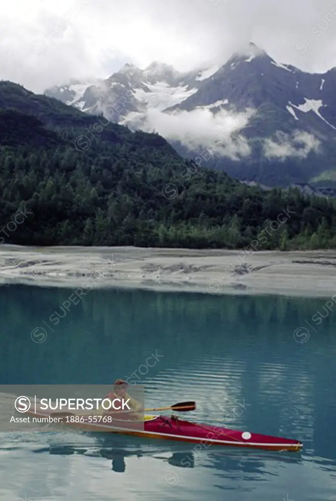 A KAYAKER surrounded by the majestic serenity of ADAMS INLET - GLACIER BAY NATIONAL PARK, ALASKA (MR)