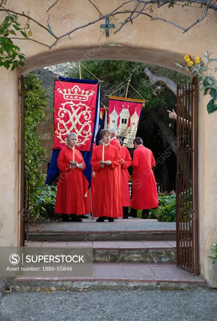 Church members carry banners reenacting the MEDIEVAL TRADITION during the CARMEL BACH FESTIVAL - CARMEL MISSION, CALIFORNIA