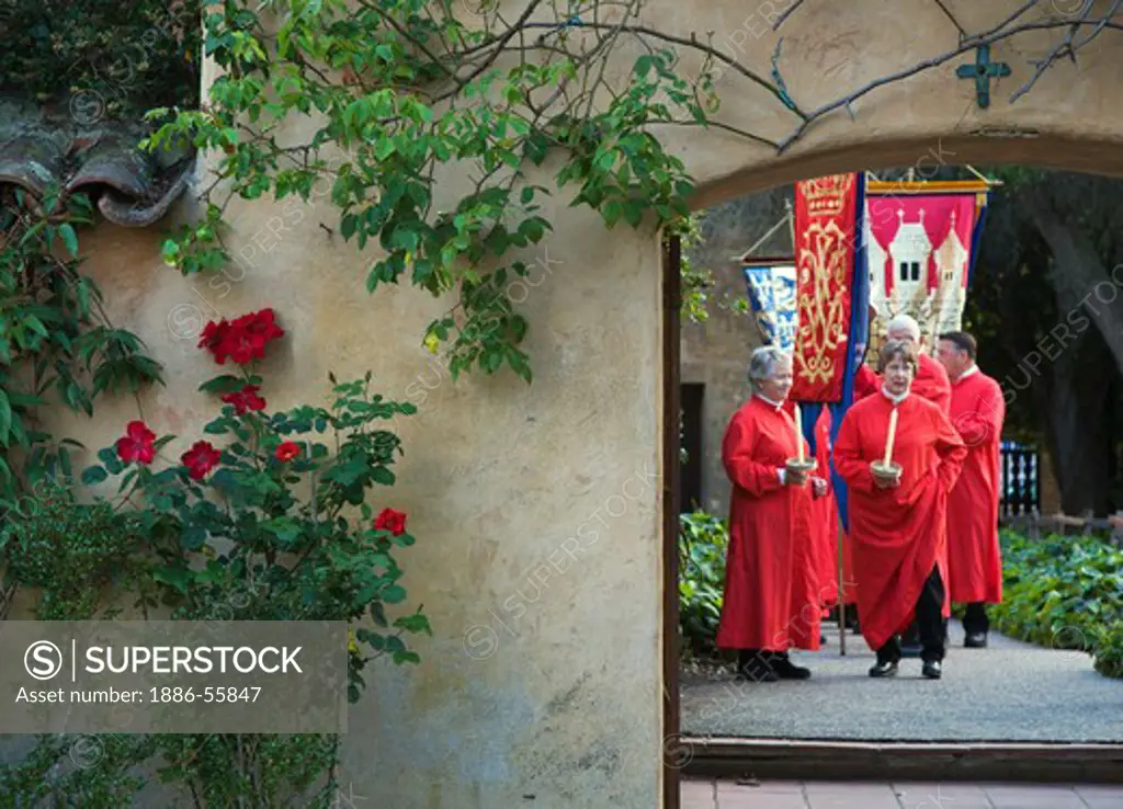 Church members carry banners reenacting the MEDIEVAL TRADITION during the CARMEL BACH FESTIVAL - CARMEL MISSION, CALIFORNIA