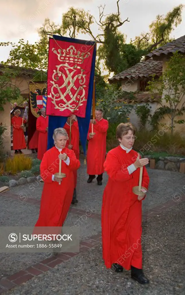 Church members carry banners  reenacting the MEDIEVAL TRADITION during the CARMEL BACH FESTIVAL - CARMEL MISSION,  CALIFORNIA