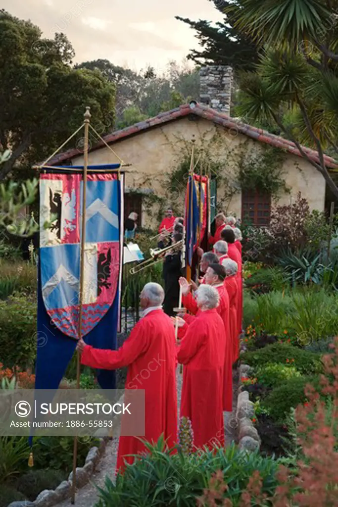 Church members carry banners while musicians play classical music during the CARMEL BACH FESTIVAL - CARMEL MISSION,  CALIFORNIA