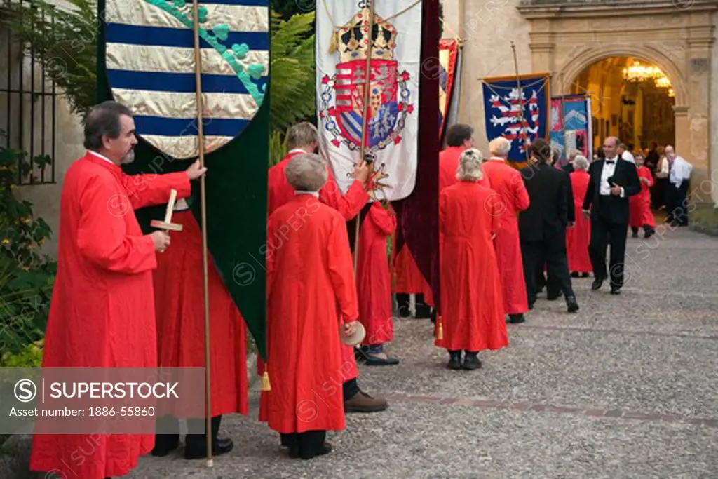 Church members carry banners into the church reenactment the MEDIEVAL TRADITION during the CARMEL BACH FESTIVAL - CARMEL MISSION,  CALIFORNIA