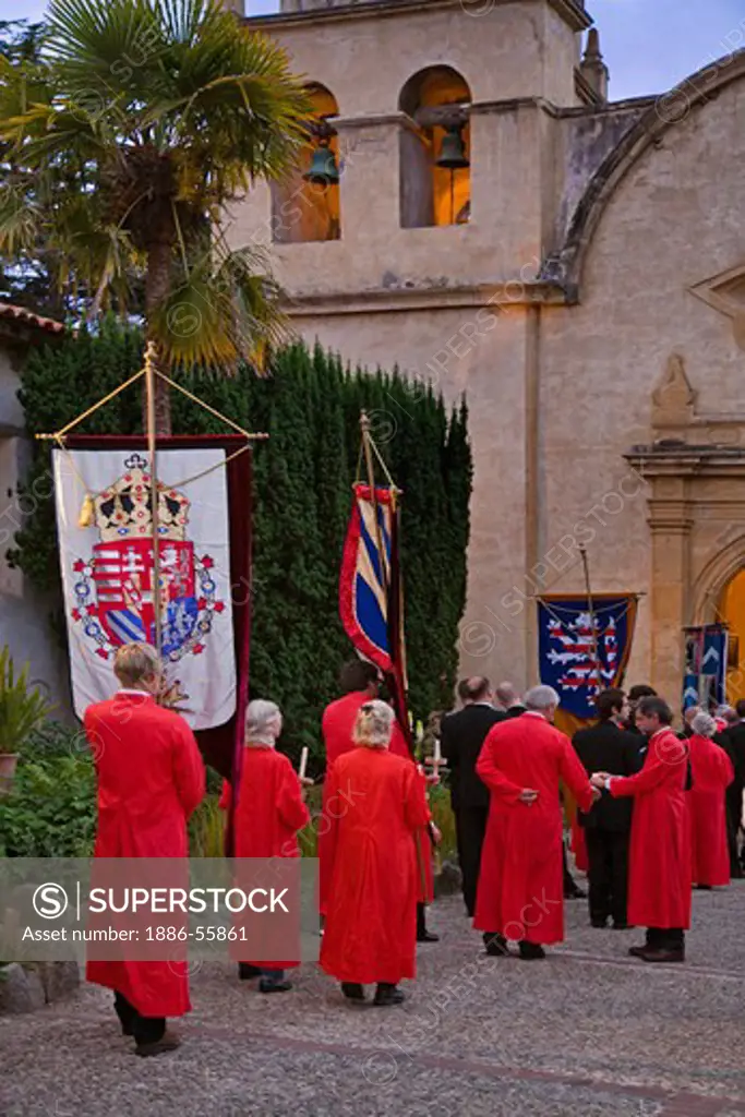Church members carry banners into the church reenactment the MEDIEVAL TRADITION during the CARMEL BACH FESTIVAL - CARMEL MISSION,  CALIFORNIA