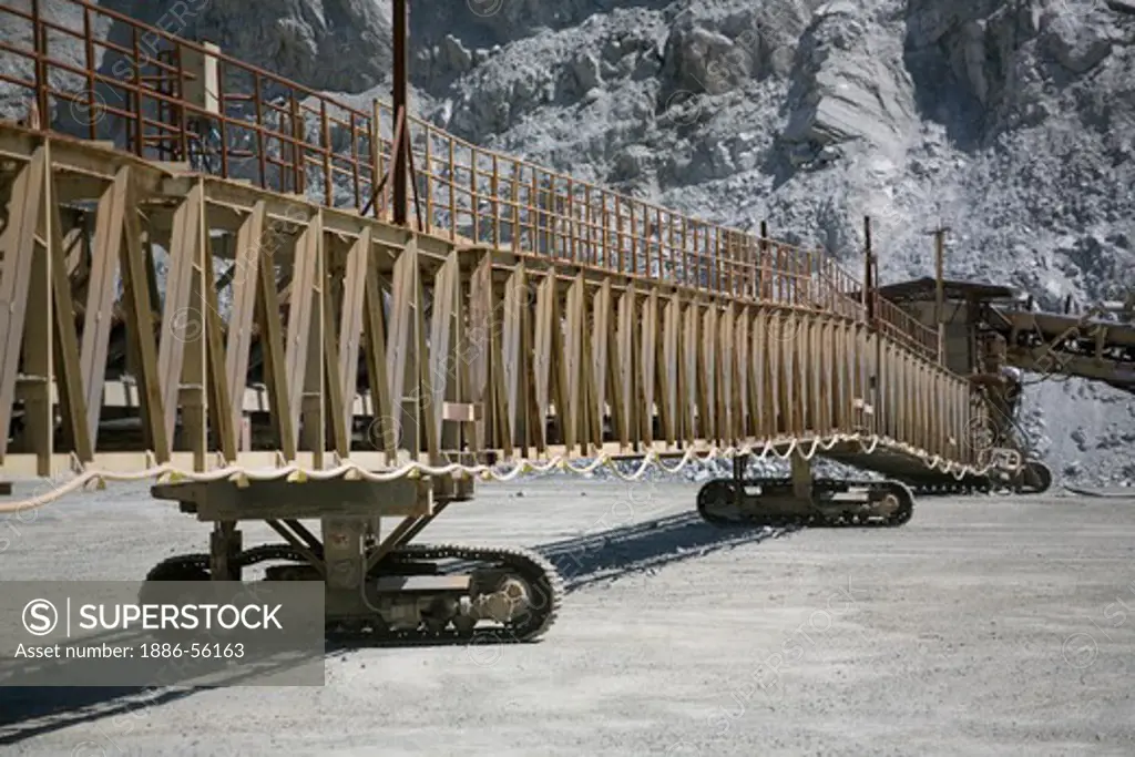 CONVEYER BELT moves harvested ROCK at the GRANITE ROCK QUARRY  - AROMAS, CALIFORNIA