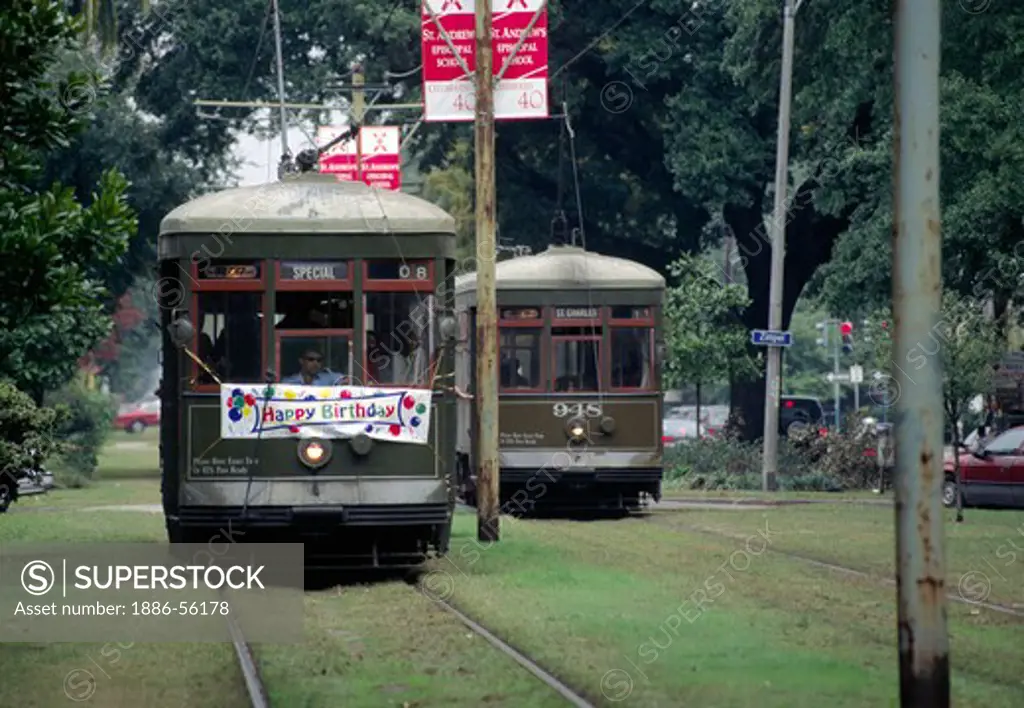 TROLLEY CARS pass on ST. CHARLES AVE - NEW ORLEANS, LOUISIANA