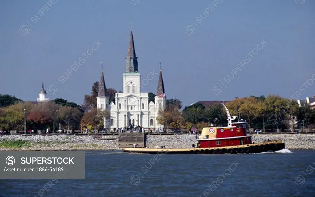 ST LOUIS CATHEDRAL in the FRENCH QUARTER as seen across the MISSISSIPPI RIVER with TUGBOAT - NEW ORLEANS, LOUISIANA