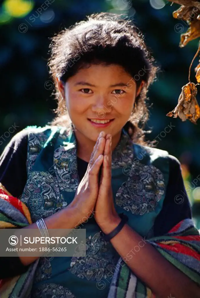 SHERPANI gives a NAMASTE greeting in the remote village of UPPER WALENG on the return journey from MAKALU - NEPAL