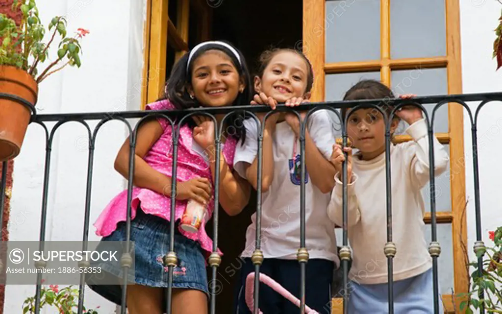 Three cute young MEXICAN GIRLS on a BALCONY - GUANAJATO, MEXICO