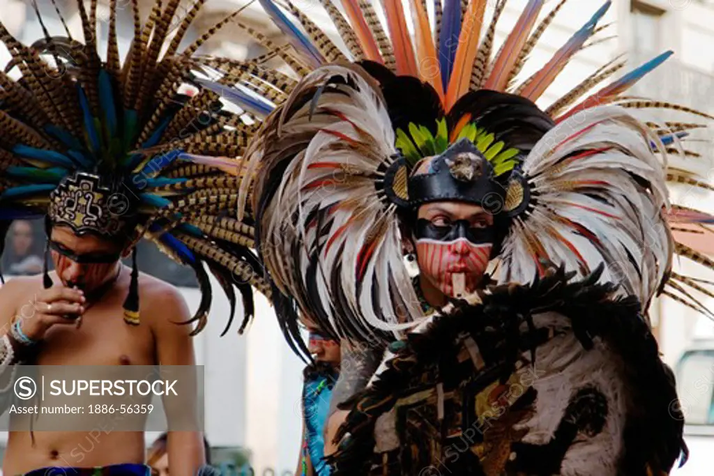 AZTEC DANCERS performs in a traditional warrior feathered COSTUME during the CERVANTINO FESTIVAL  - GUANAJUATO, MEXICO