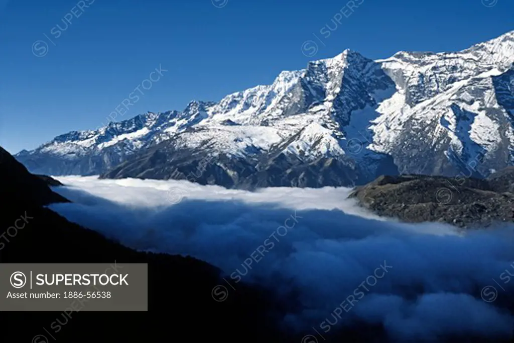 Low lying clouds & Khumbila Peak (5761 Meters) - KHUMBU DISTRICT, NEPAL