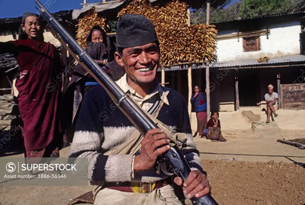 Gurung hunter with his rifle - SIKLIS, NEPAL HIMALAYA