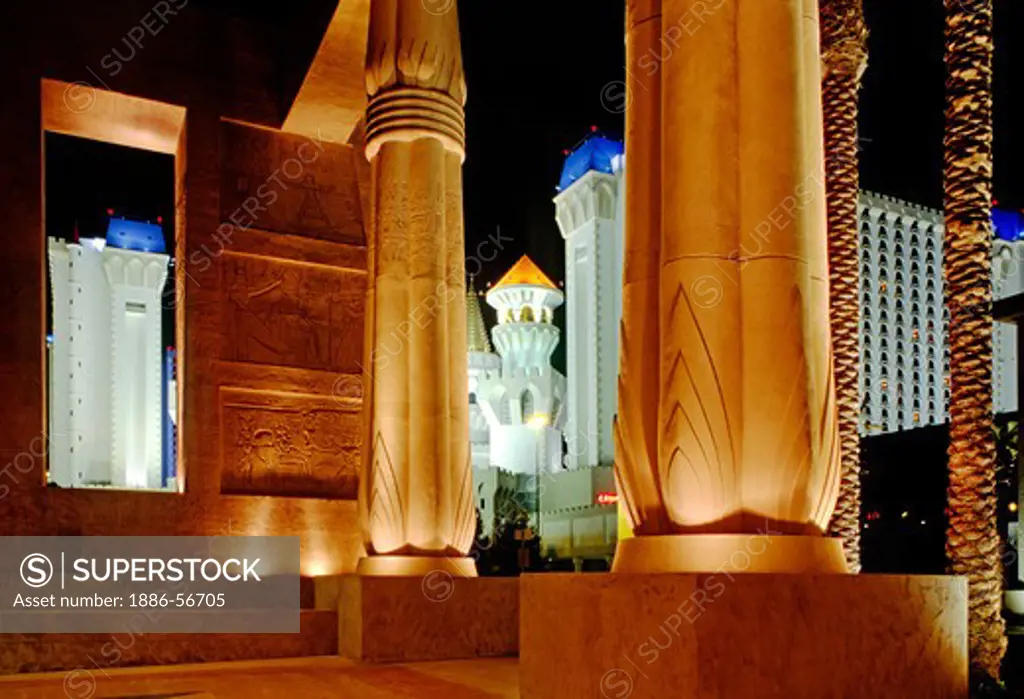 EXCALIBUR HOTEL and GAMBLING CASINO is seen through the columns of the LUXOR PYRAMID - LAS VEGAS, NEVADA