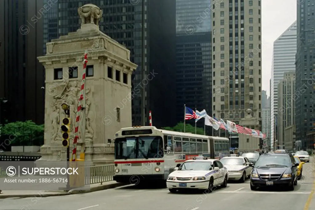 A CITY BUS, TAXIS and other vehicles cross the MICHIGAN STREET BRIDGE - CHICAGO, ILLINOIS