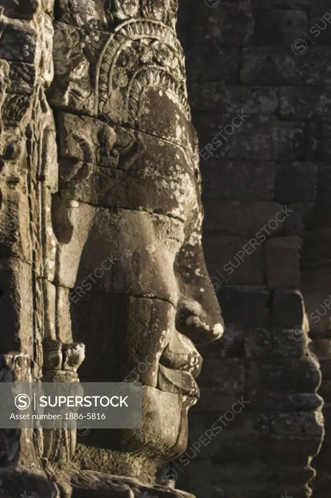 A face tower of The Bayon at Angkor Thom, the largest Khmer city ever built, are part of the Angkor Wat complex  -  Siem Reap, Cambodia   