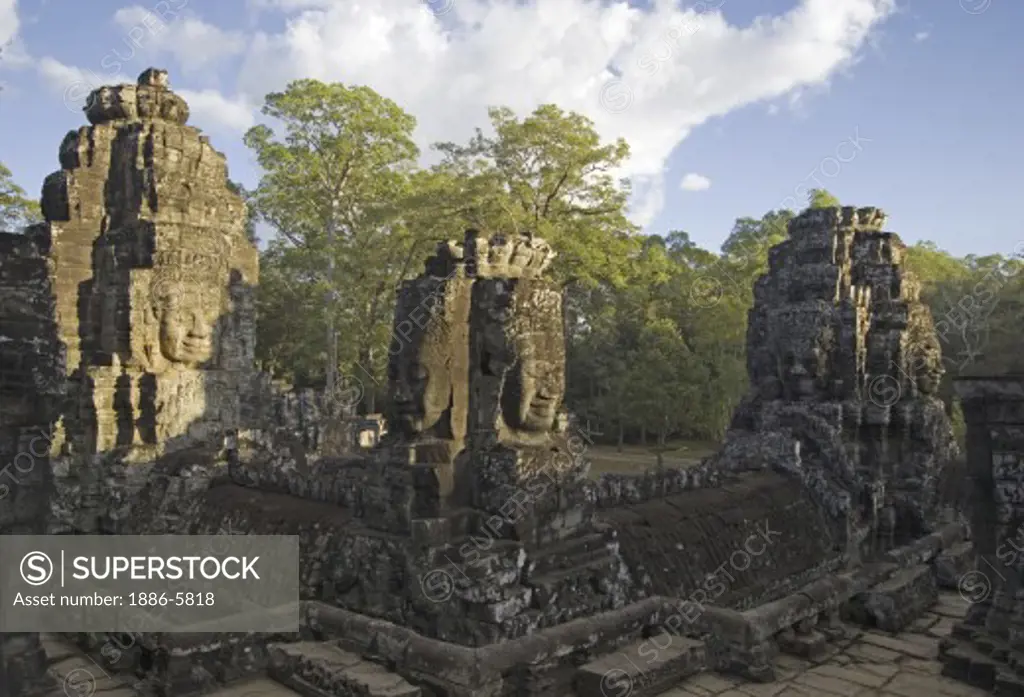 The face towers of The Bayon at Angkor Thom, the largest Khmer city ever built, are part of the Angkor Wat complex  -  Siem Reap, Cambodia  