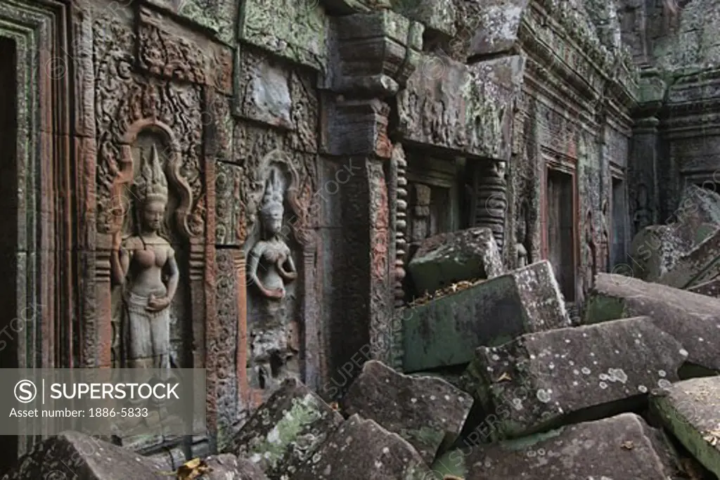 Stone carved bas relief  Apsaras (celestial maidens) at Ta Prohm, built by Jayavarman VII & part of the  Angkor Wat temple complex - Siem Reap, Cambodia   