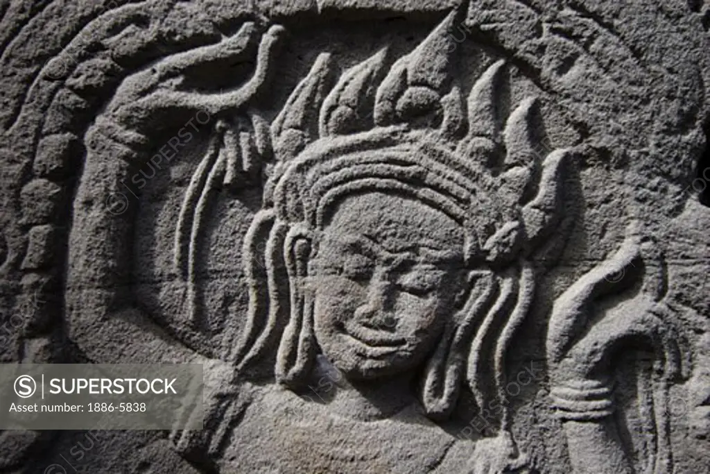 Stone carved bas relief of dancing Apsara (celestial maiden) at Banteay Kdei, built by Jayavarman VII in the Bayon style, part of Angkor Wat - Siem Reap, Cambodia    