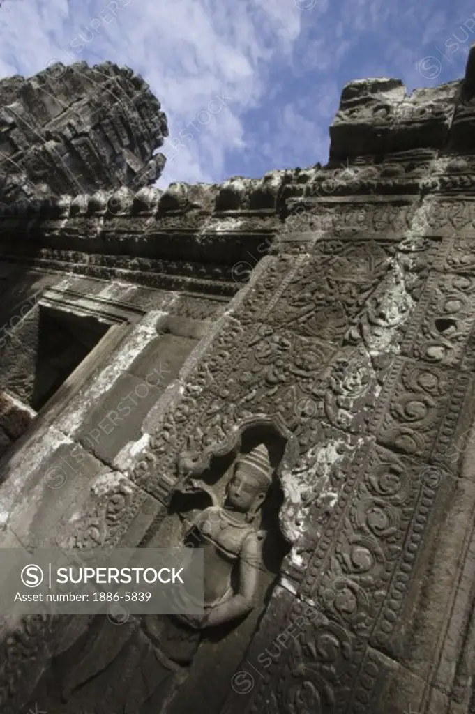 Stone carved bas relief of an Apsara (celestial maiden) at Banteay Kdei, built by Jayavarman VII in the Bayon style, part of Angkor Wat - Siem Reap, Cambodia     