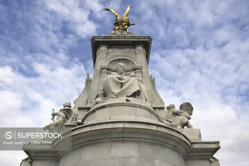 QUEEN VICTORIA MEMORIAL sits in front of BUCKINGHAM PALACE - LONDON, ENGLAND