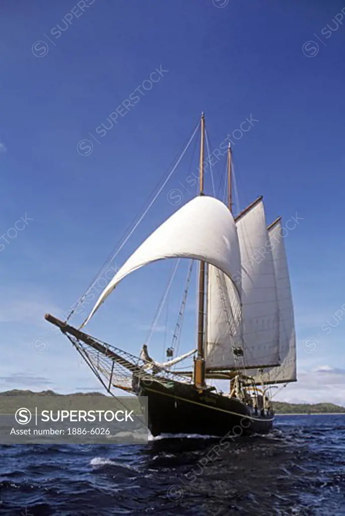 The French double masted schooner LA VIOLANTE, built in the 1920's, sails the waters of the YASAWA ISLANDS - FIJI