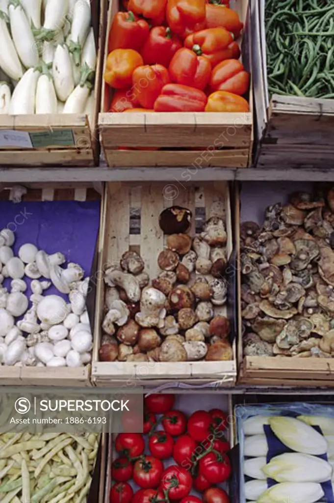 Colorful fresh produce & mushrooms on display in the golden-stone village of GORDES  - PROVENCE, FRANCE