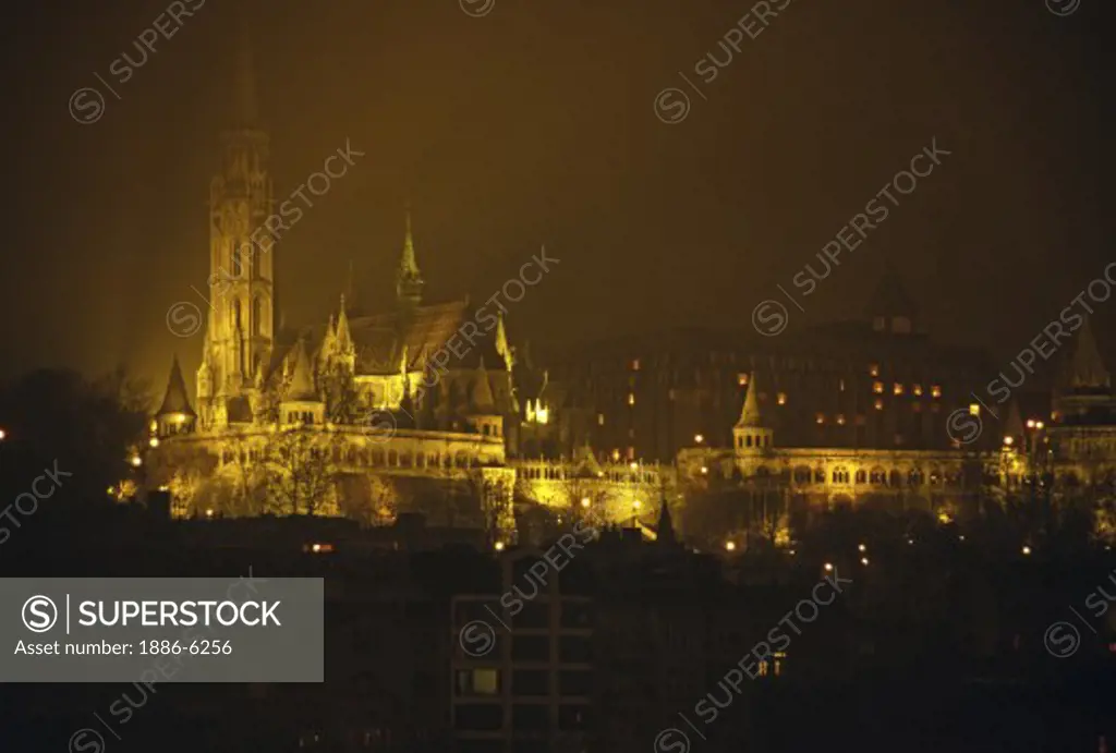 Night shot of MATTHIAS CHURCH rebuilt in 1896 with its colourful tiled roof - BUDAPEST, HUNGARY