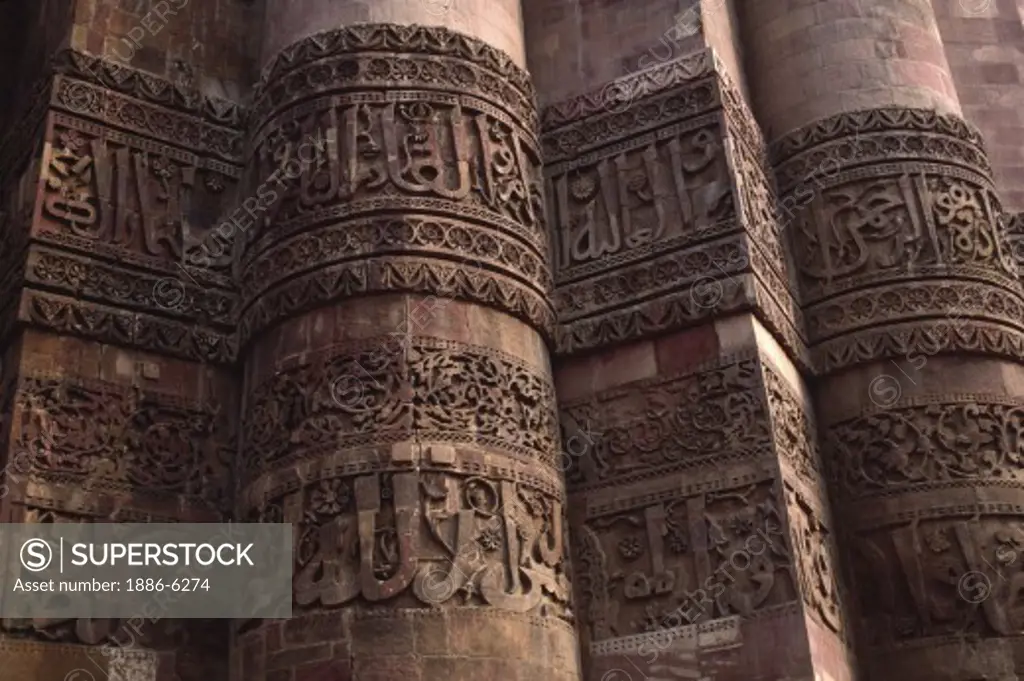 BAS-RELIEF CARVINGS in ANCIENT SCRIPT on the STONE COLUMN of the QUTAB MINAR complex - DELHI, INDIA 