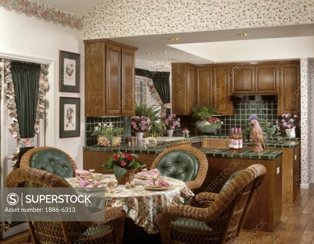 KITCHEN & DINING ROOM with WICKER CHAIRS, GREEN TILE and WINDOW TREATMENTS & OAK CABINETS