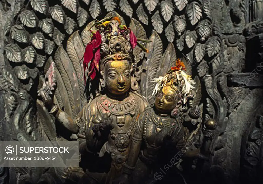 A bronze statue of Shiva & Parvati at the Tusha Hiti or sunken royal bath created around 1670 - Pattan Royal Palace 