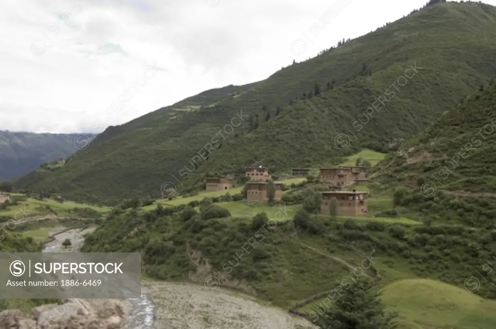 River valley with barley fields and traditional houses near Katok Monastery - Kham (E. Tibet), Sichuan Province, China