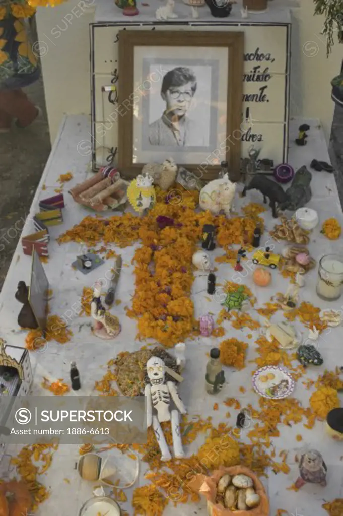A shrine on a loved ones grave during the DEAD OF THE DEAD ceremony - SAN MIGUEL DE ALLENDE, MEXICO  