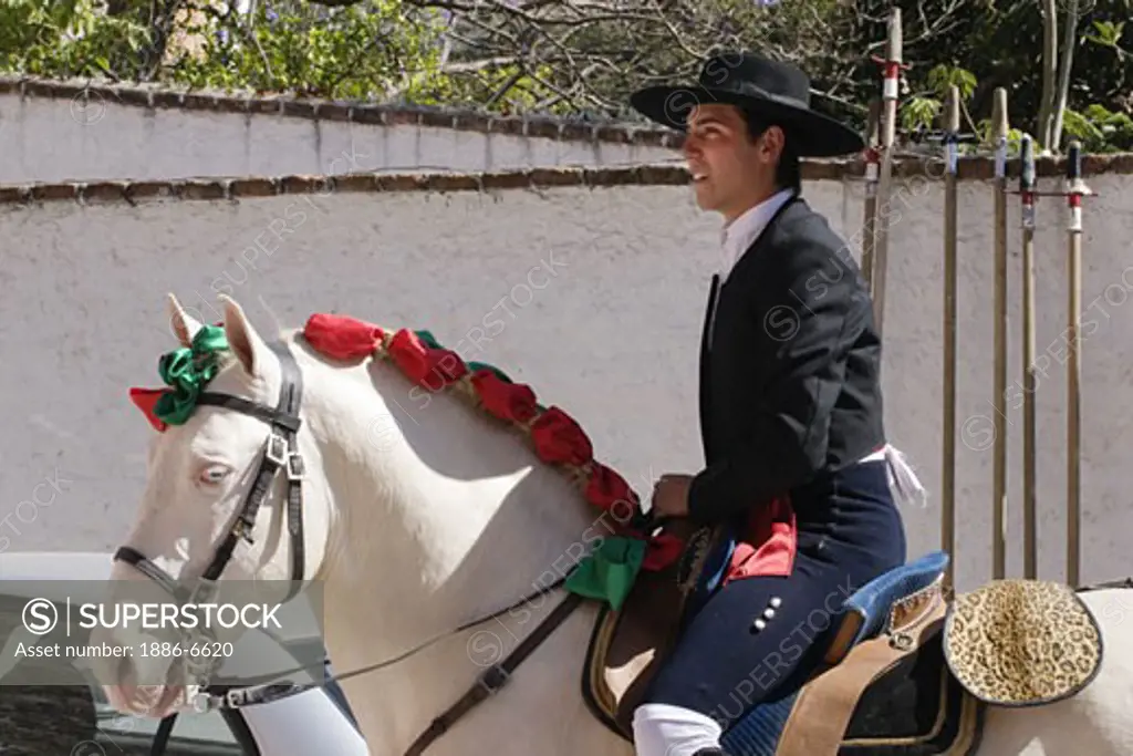 The picador RODOLFO BELLO on his white stallion during a bull fight - SAN MIGUEL DE ALLENDE, MEXICO   