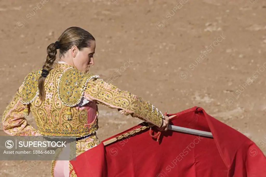 The female matador RAQUEL SANCHEZ fights a bull in the Plaza de Toros - SAN MIGUEL DE ALLENDE, MEXICO   