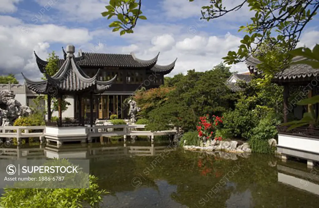 A pavilion & the Tea House sits across Zither Lake at the Portland Classical Chinese Garden,  an authentically built Ming Dynasty style garden - PORTLAND, OREGON 