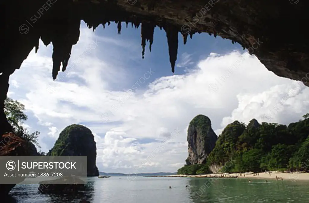 Clear tropical waters & LIMESTONE CLIFFS as seen from inside a CAVE in the beach resort of KRABI on the Andaman Sea - THAILAND 