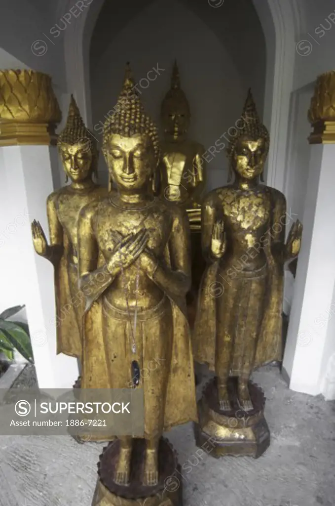 CELL PHONE & BUDDHAS STATUE at WAT NA PRAMAN (WAT NAPHRAMERU) built by RAMADHIBODI - AYUTTHAYA, THAILAND