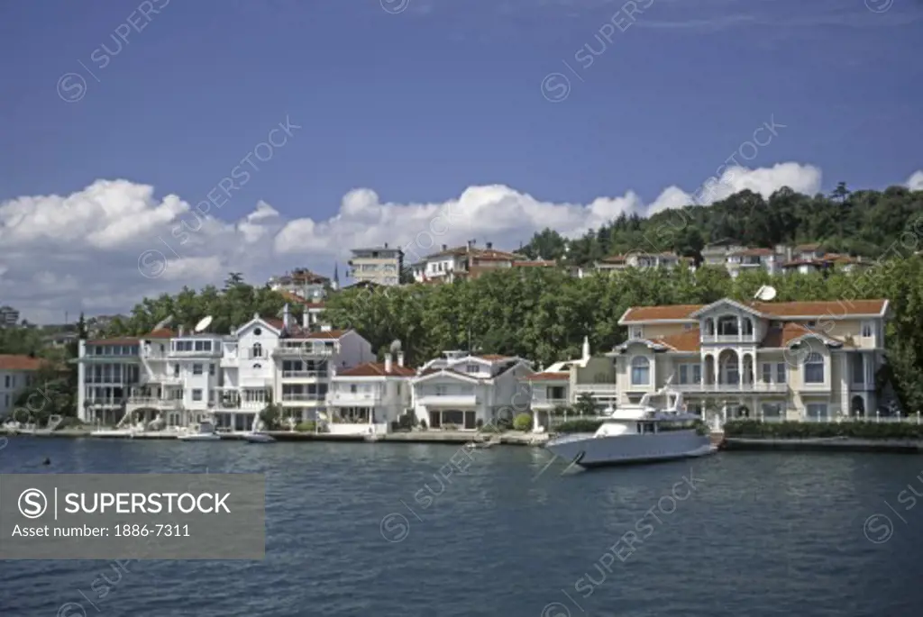 Luxury homes line the shore of  the BOSPHORUS (the waterway which joins the Mediterranean & the Black Sea) - Istanbul, Turkey