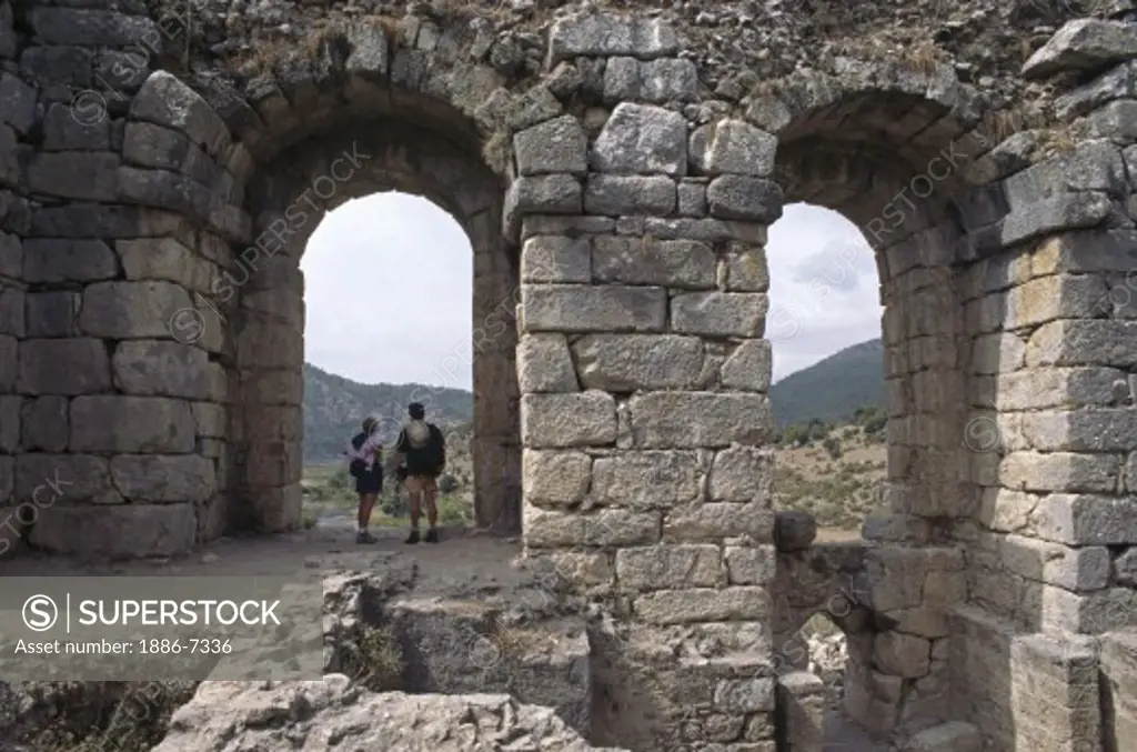 Travelers visit the Byzantine Basilica at The Ruins of CAUNUS which date to 400 BC - TURQUOISE COAST, TURKEY